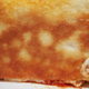 golden brown bottom of pizza